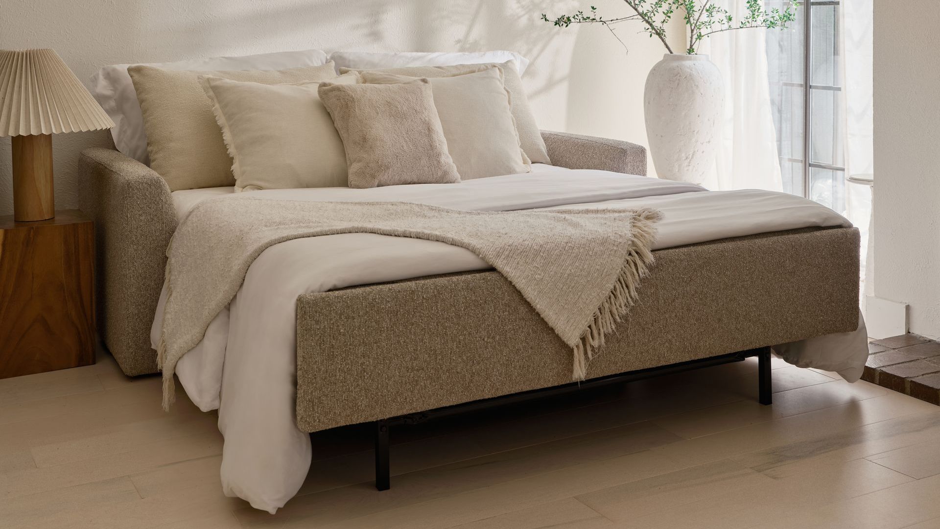 Clara Comfort Sleeper from American Leather open and dressed.