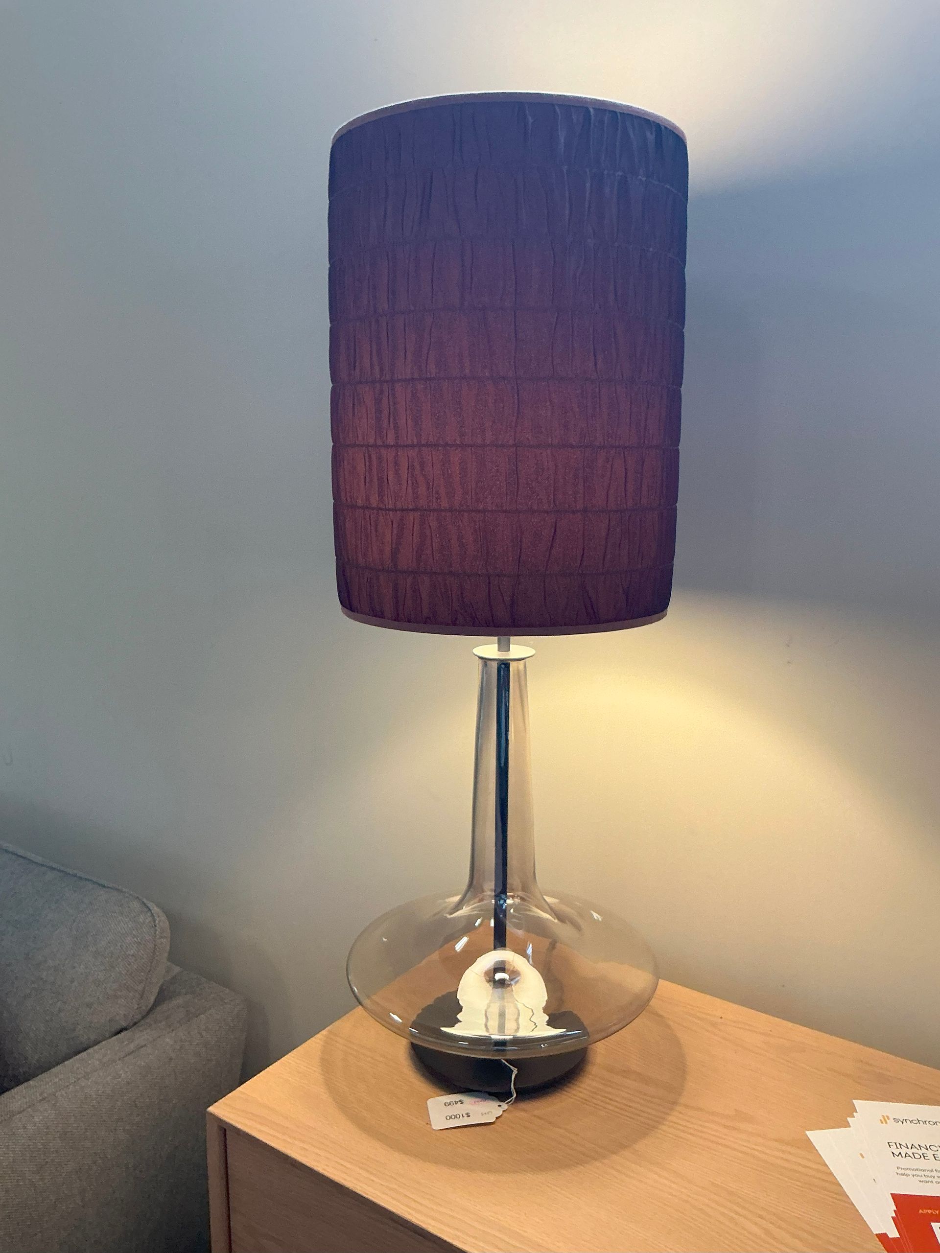 Penta lightly smoked glass table lamp with rust colored fabric shade