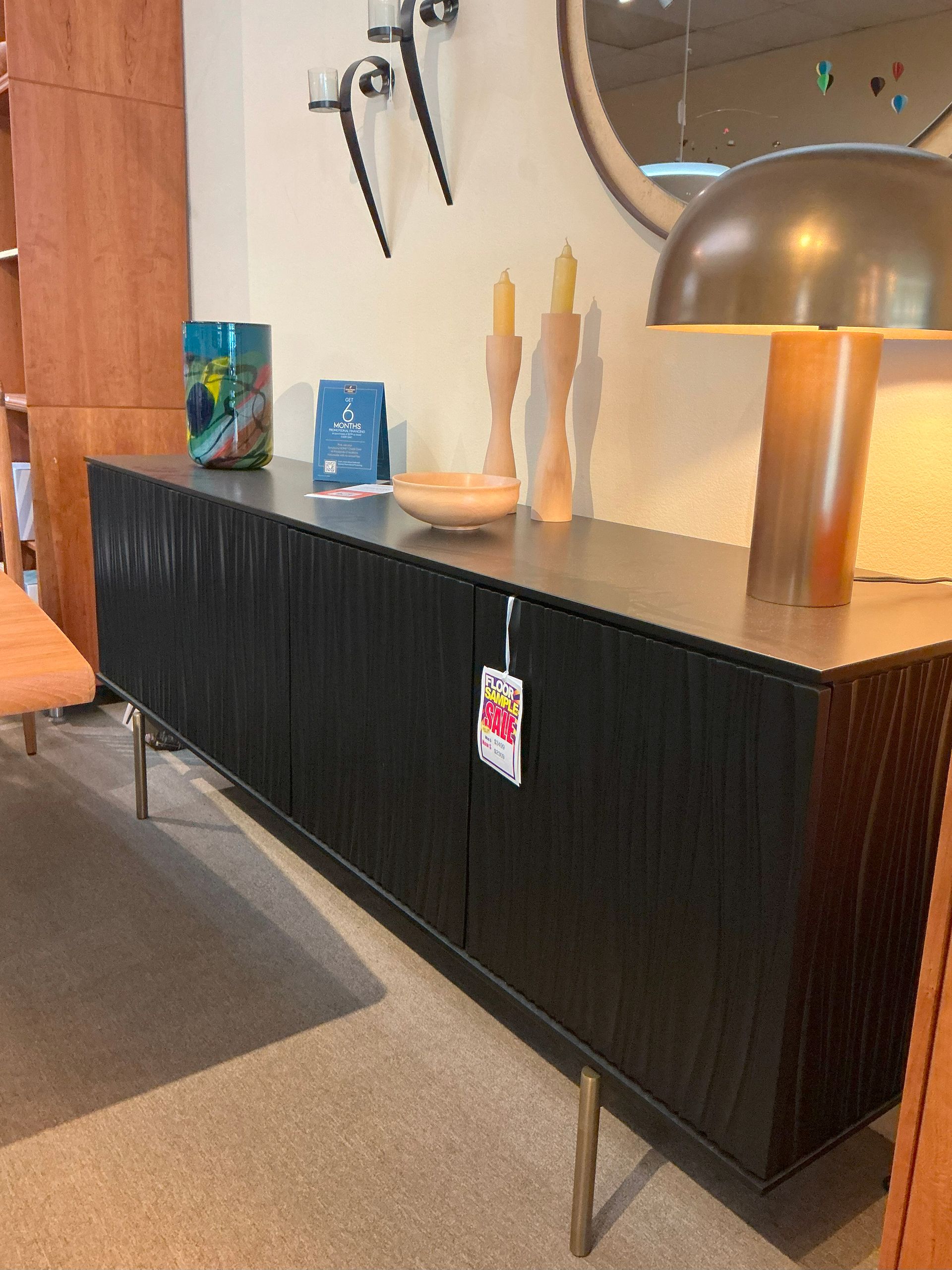 Storage credenza in Satin Black with brass legs
