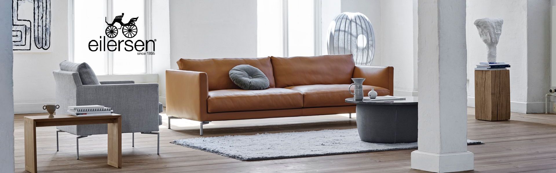Stressless Stella Sofa, armless chair and ottoman in leather with optional headrest.