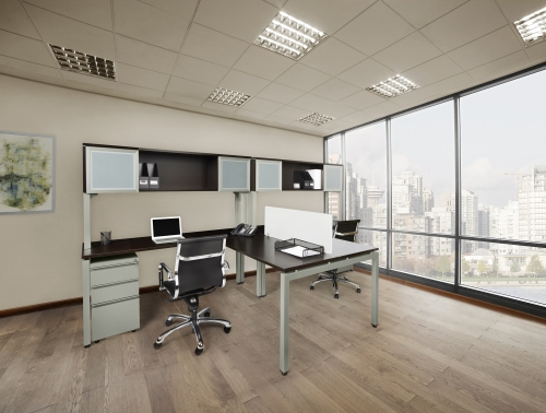 An office with two desks and chairs and a large window.