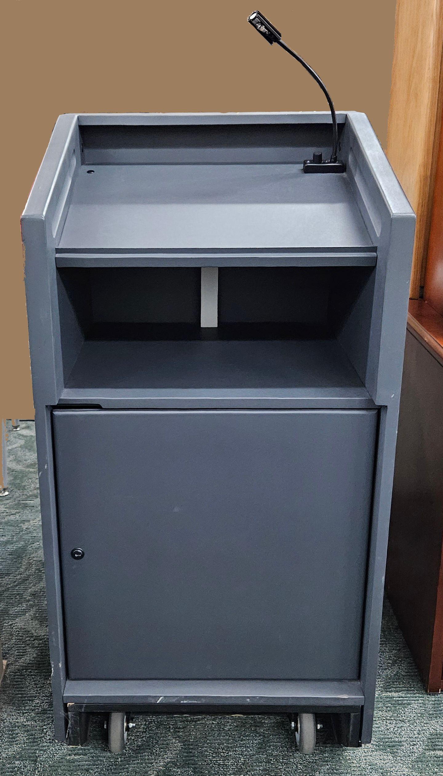 A podium with a microphone on top of it