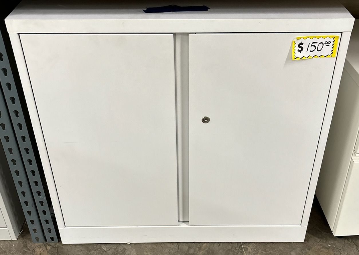A white cabinet with a price tag on it is for sale.