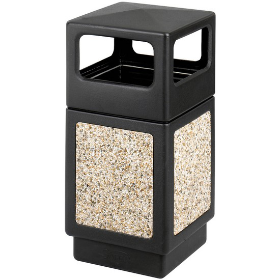 A black trash can with a stone border is sitting on a white surface.