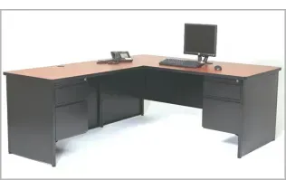 An l shaped desk with a computer on it