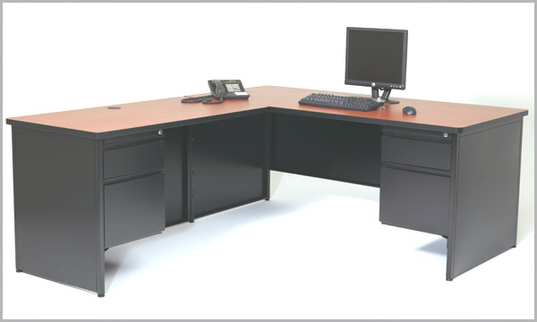 An l shaped desk with a computer on it