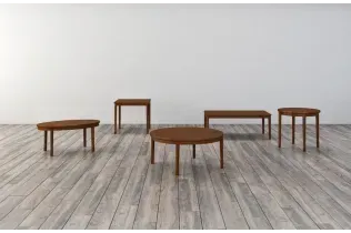 A group of wooden tables sitting on top of a wooden floor.