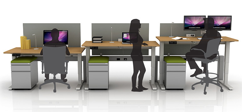 A silhouette of people sitting at desks with computers