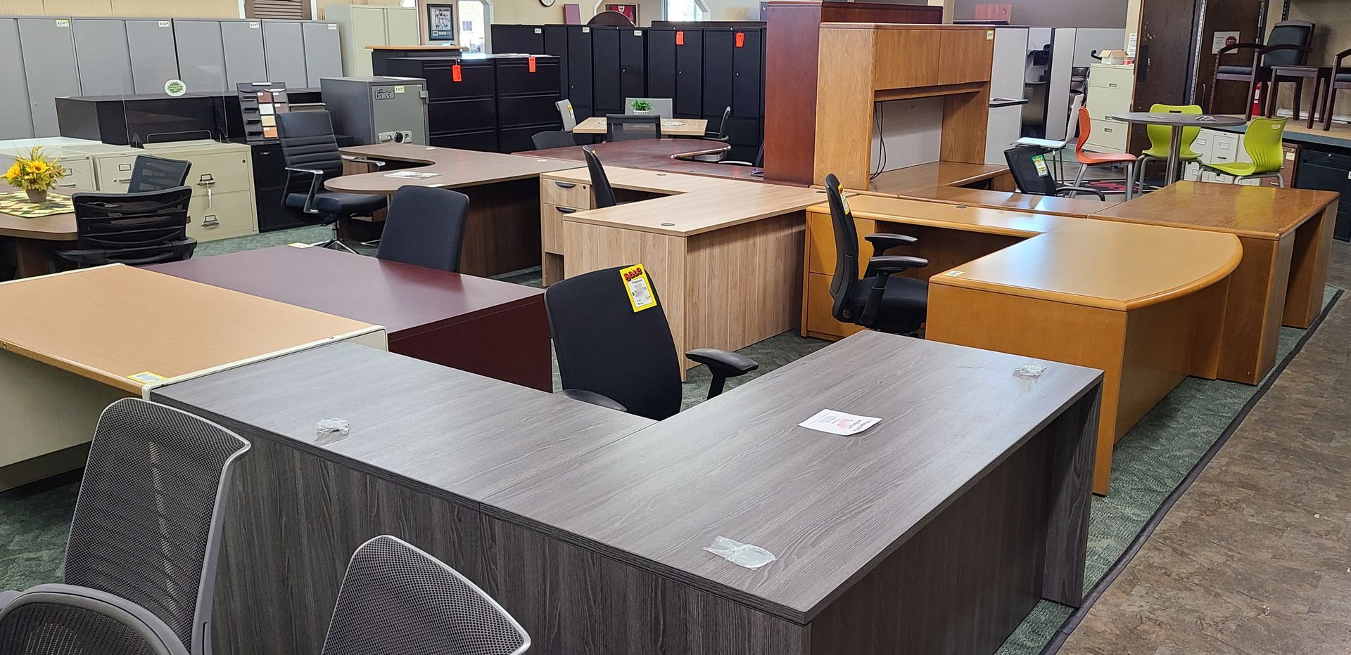 A large room filled with lots of tables and chairs.