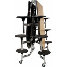 A table and chairs are stacked on top of each other on a white background.