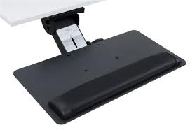 A black keyboard tray is attached to a white desk.