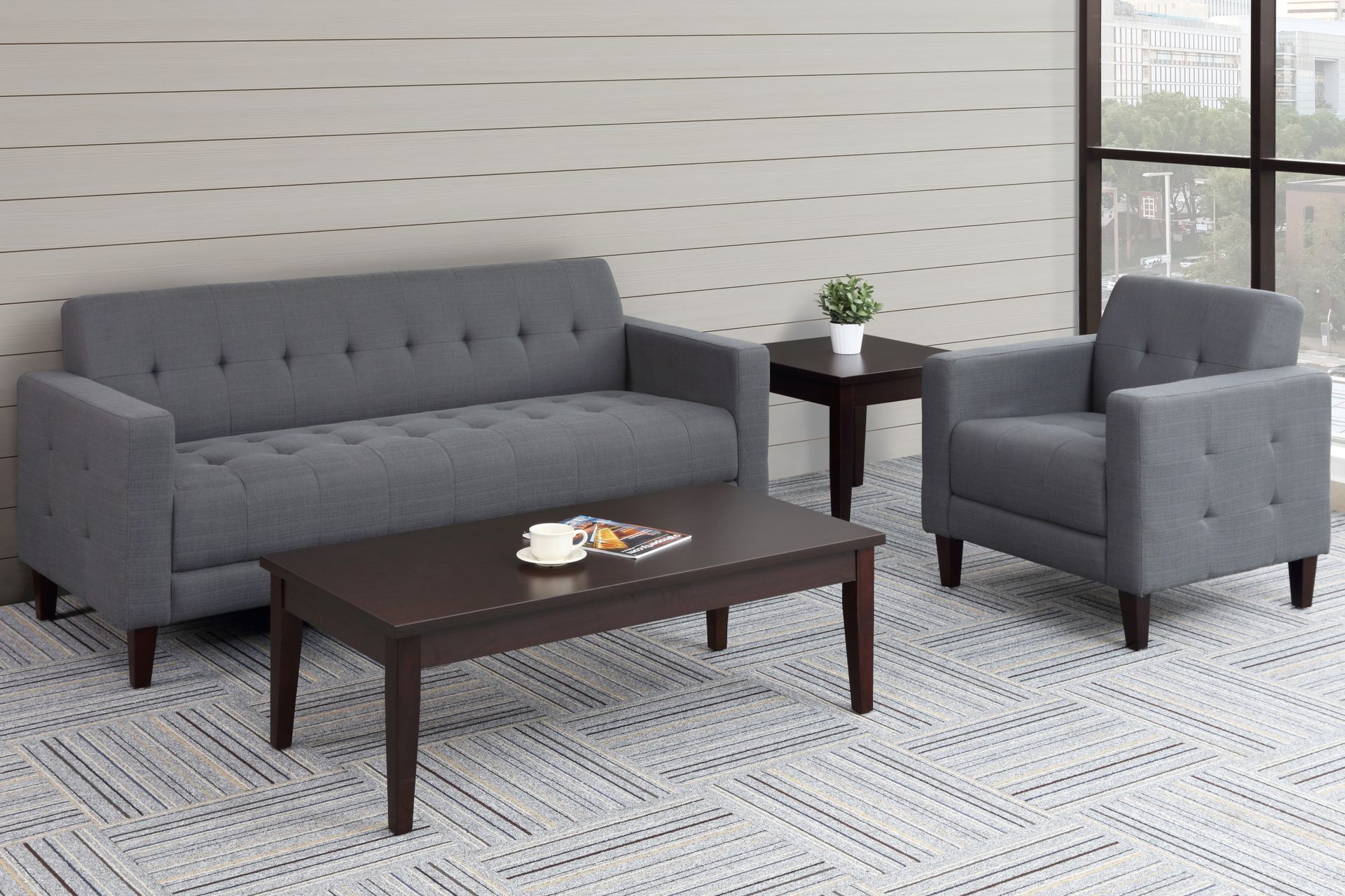 A living room with a couch a chair and a coffee table