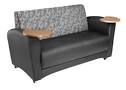 A black couch with a wooden table on the arm.