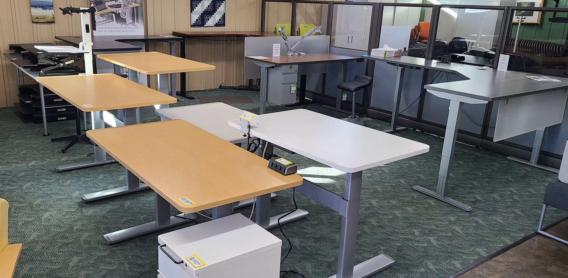 A room with a lot of standing desks in it