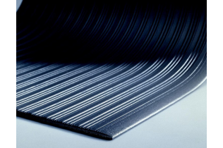A close up of a black rubber mat with white stripes