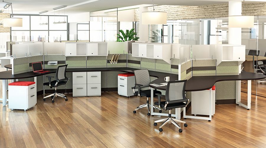 A large office with a lot of desks and chairs.