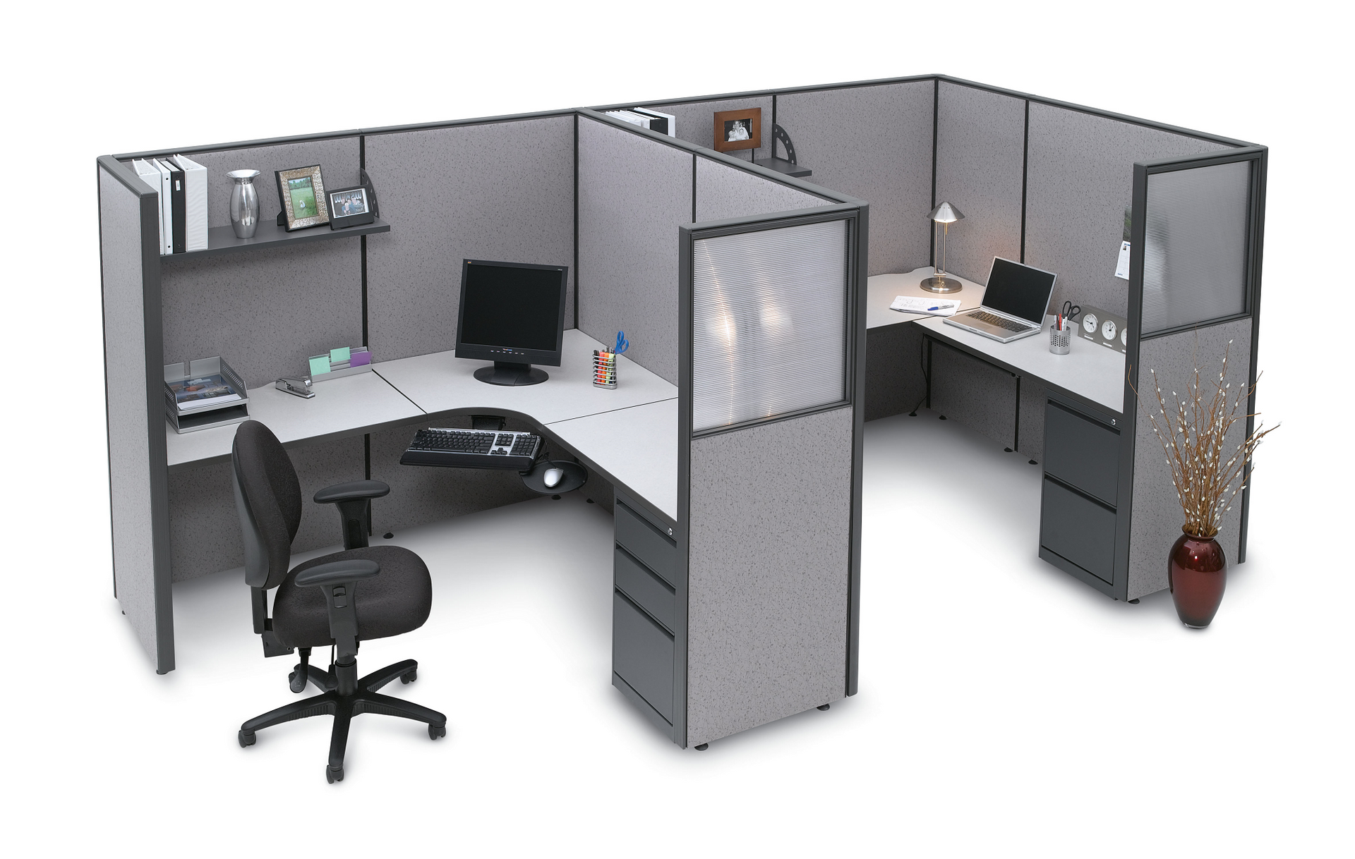 A cubicle with a chair and a computer on it