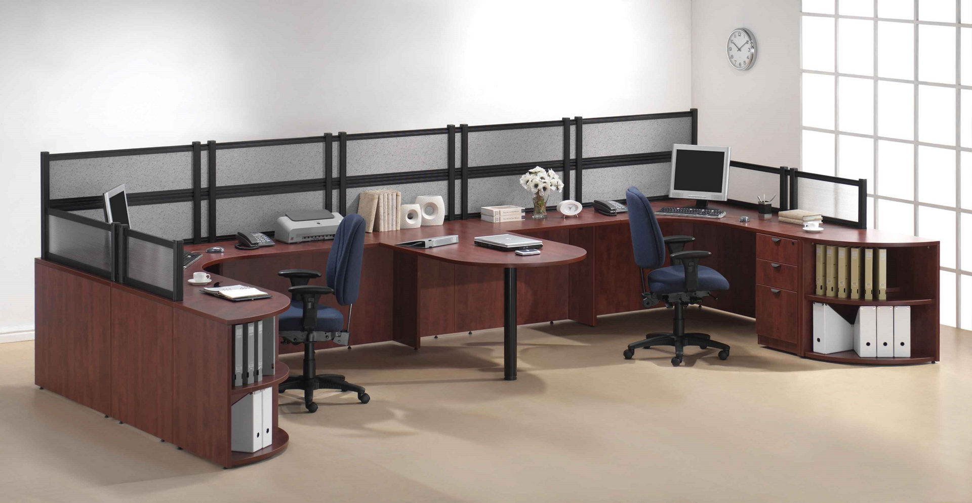 An office with cubicles and a clock on the wall