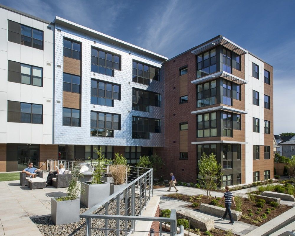 A large apartment building with a lot of windows