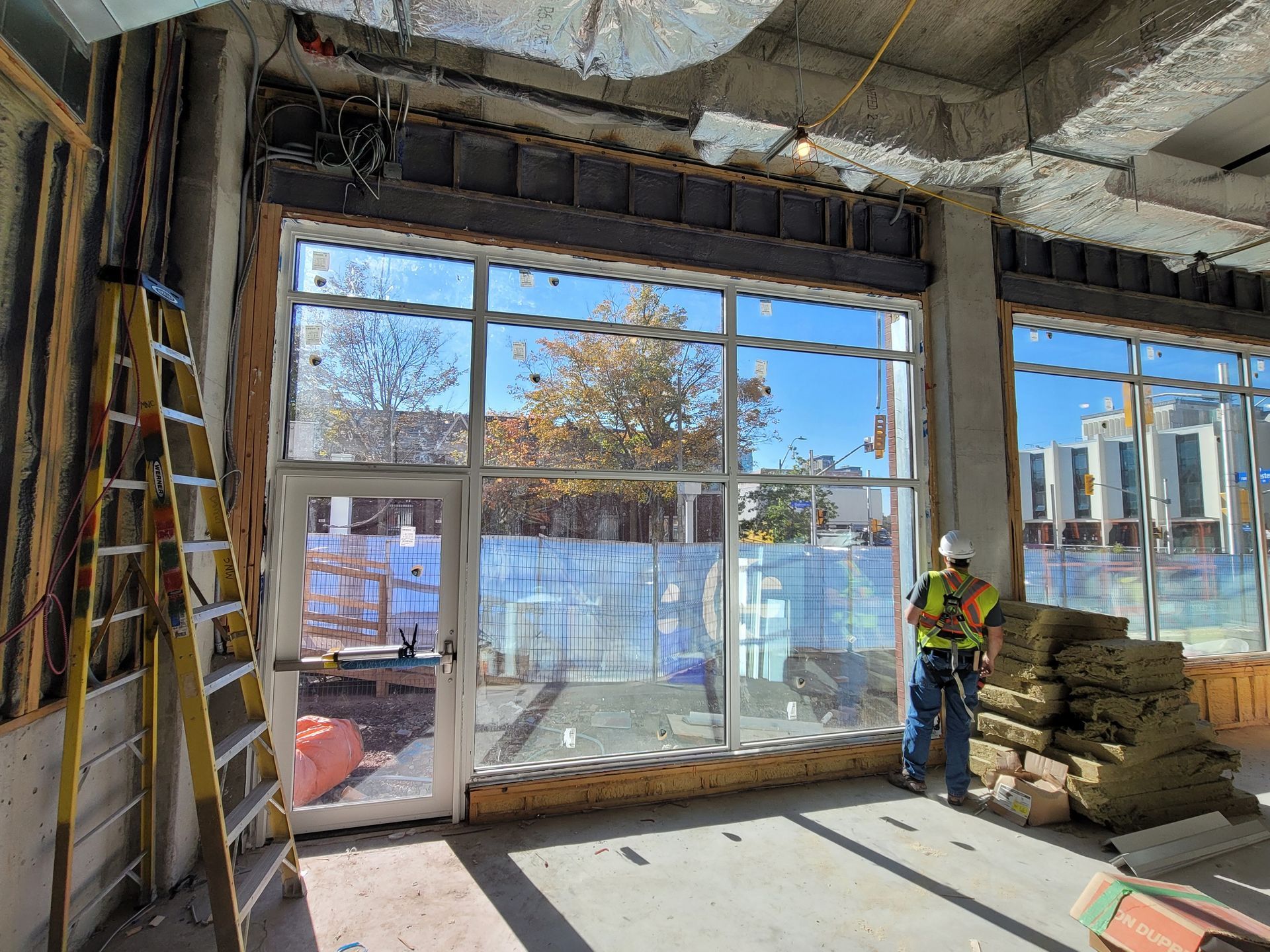 A bathroom with a tub , sink , mirror and shower.