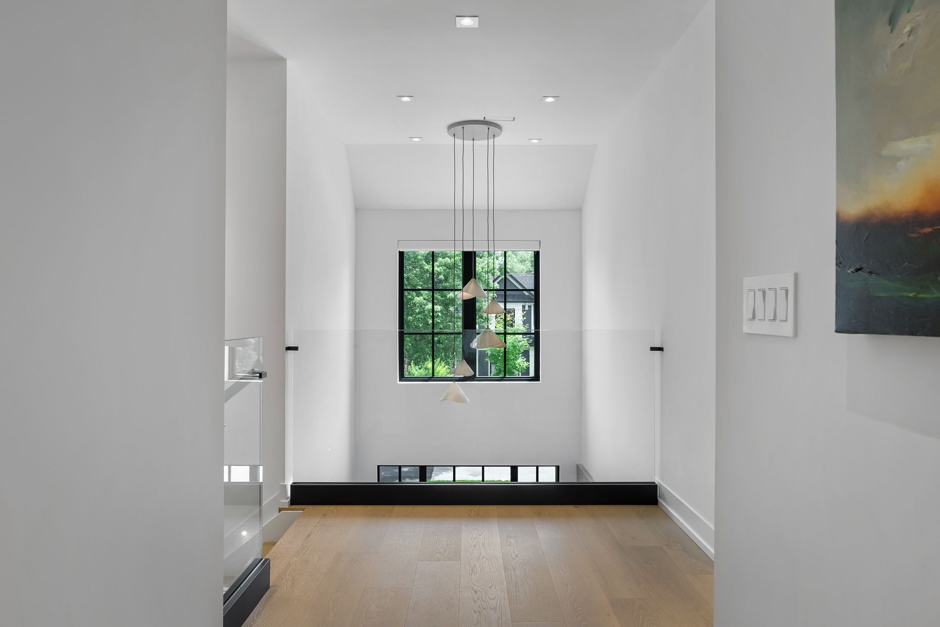 A bedroom with a large bed and a large window.