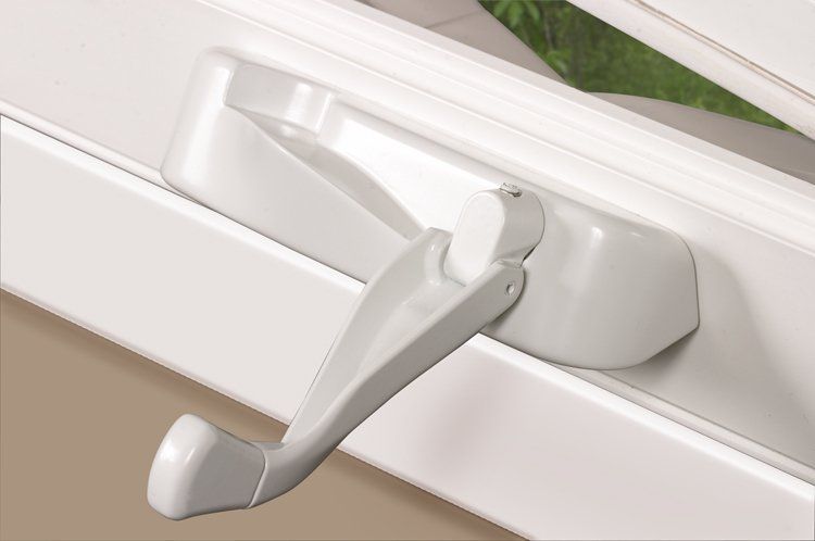 White casement window crank handle on a window frame. The handle is in an open position.