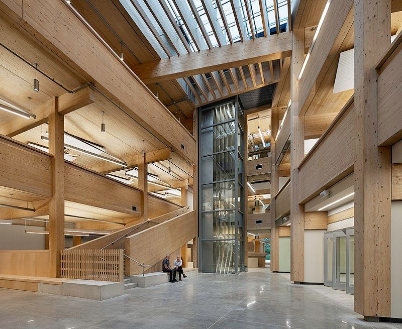 A bathroom with a tub , sink , mirror and shower.