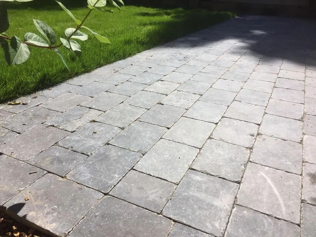 Urban Paving Bristol | A brick walkway leading to a lush green lawn.