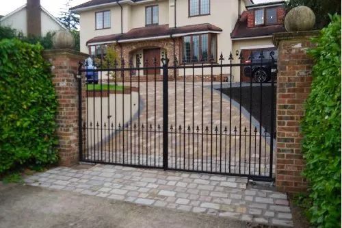 Urban Paving Bristol | A large house with a black gate in front of it
