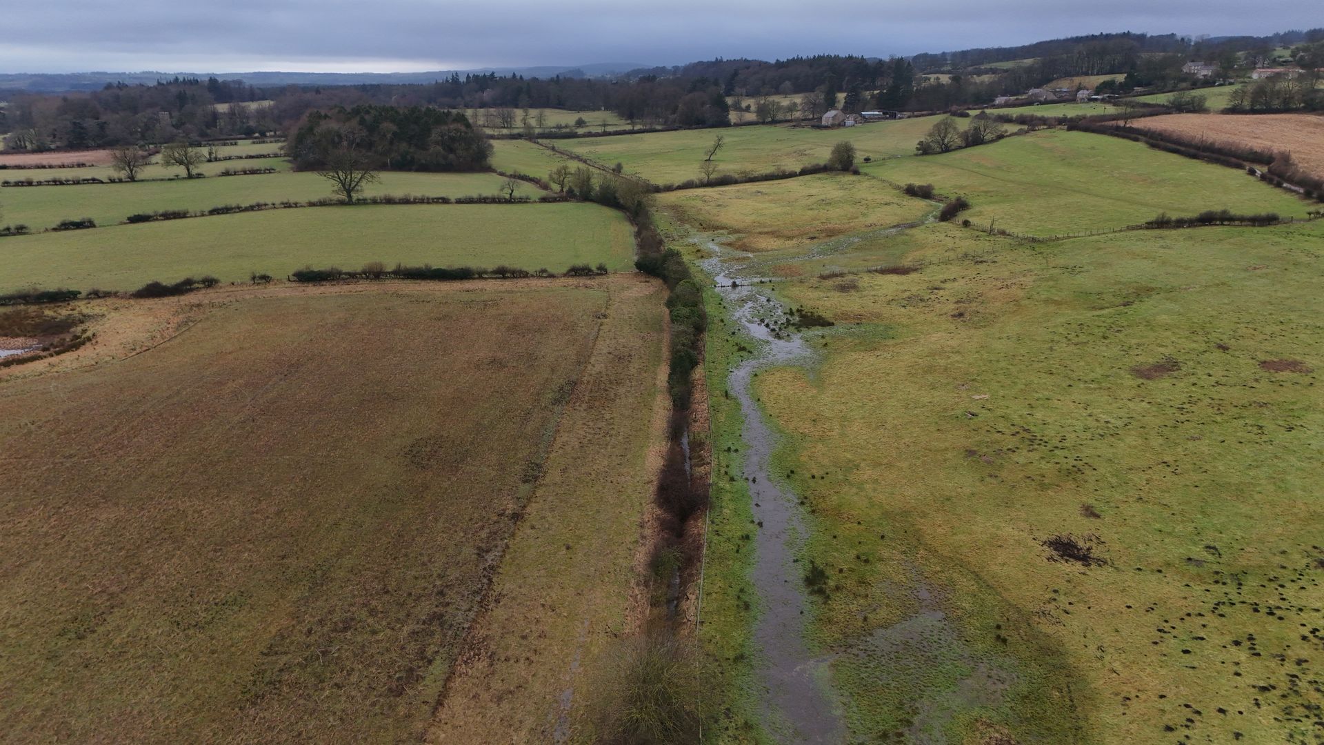 A flooded stream running through the landscape
