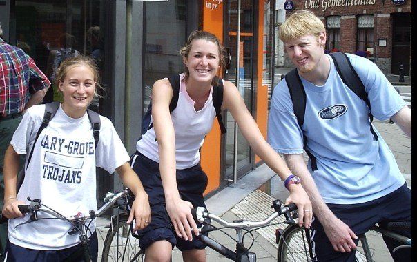 3 young adults on bikes in Belgium
