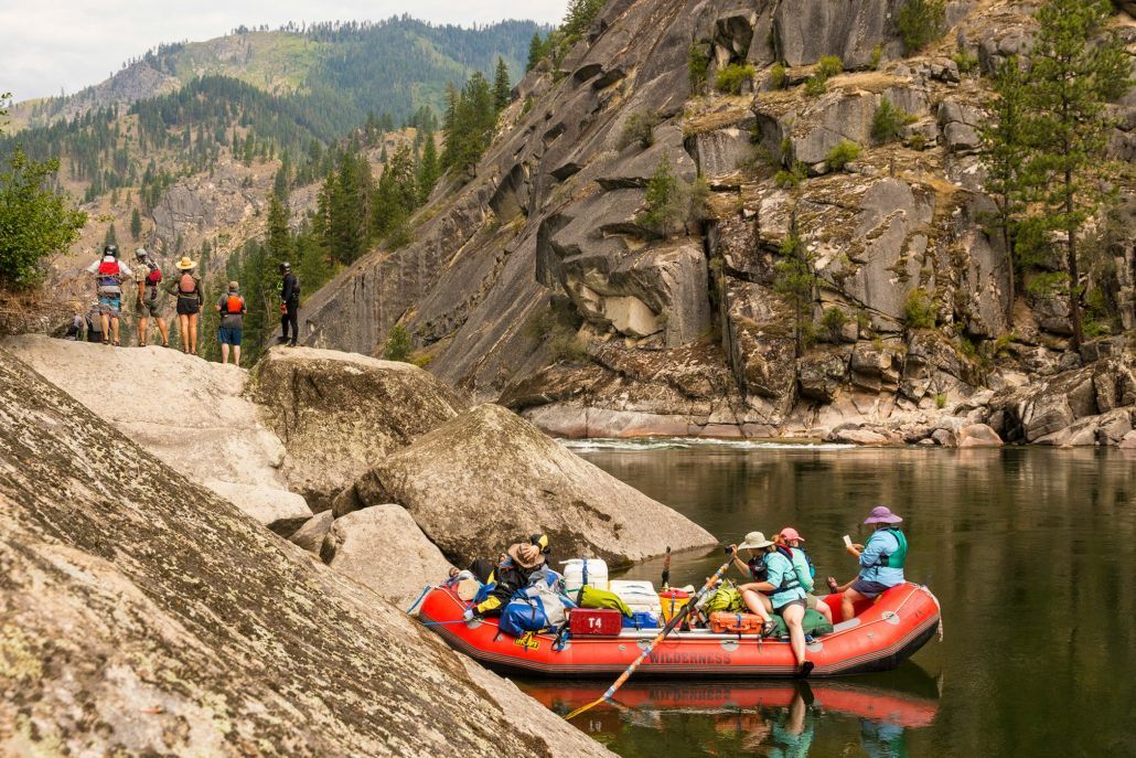 A group of people are rafting down a river.