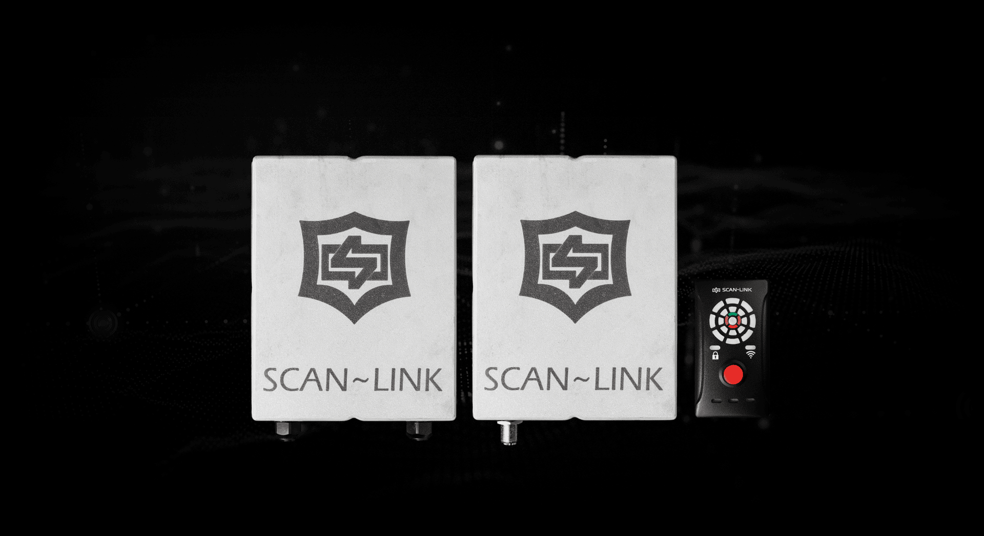 Two white Scan-Link boxes and a remote control on a black background.
