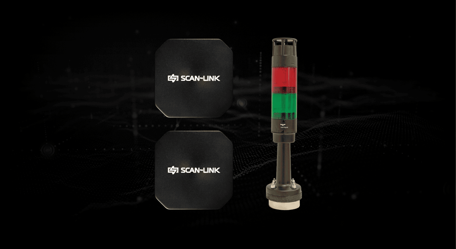 Yellow industrial sensor and red-green stack light on a dark background