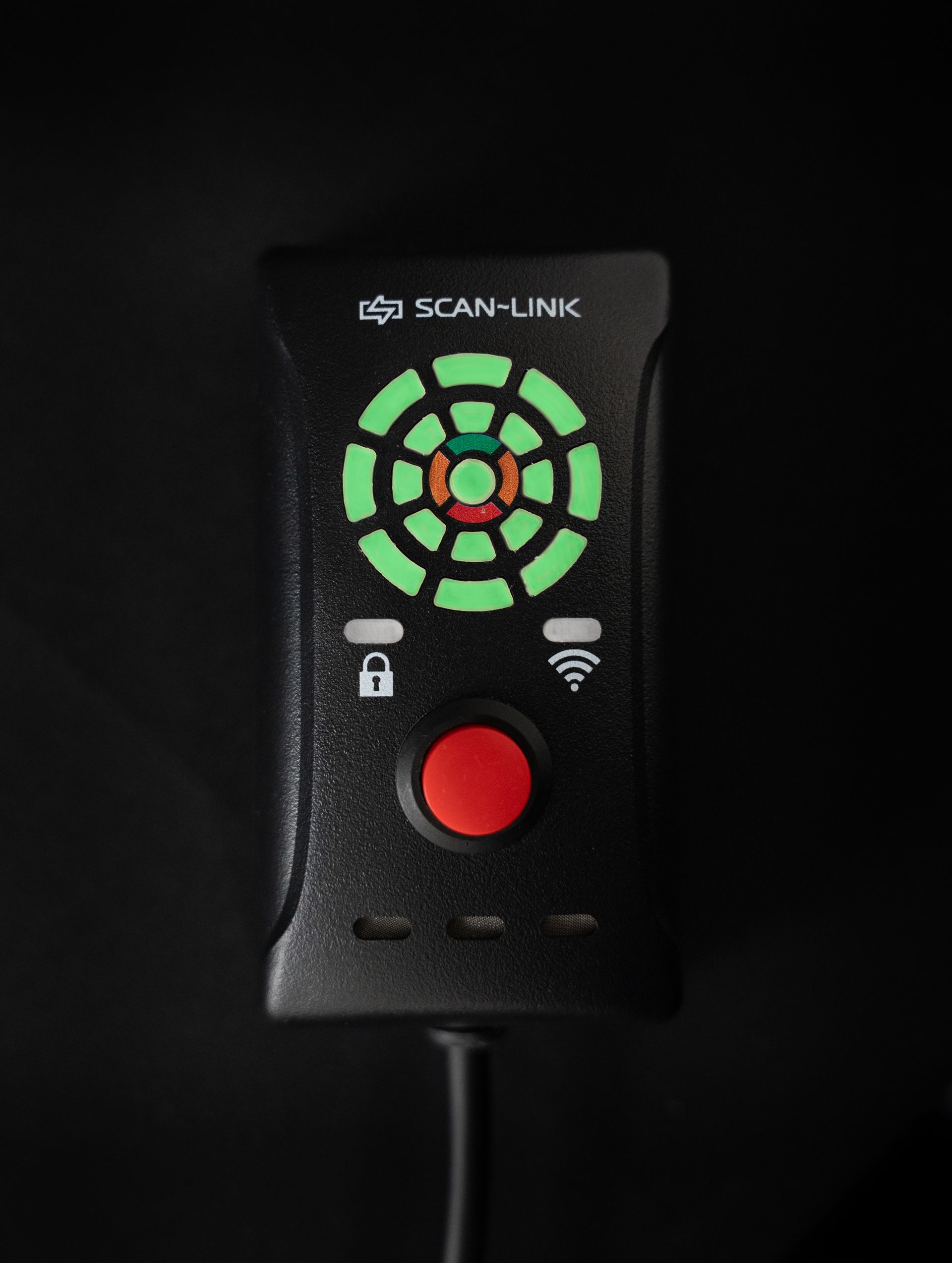 Black Scan-Link device with a circular green light display, red button, and cable.