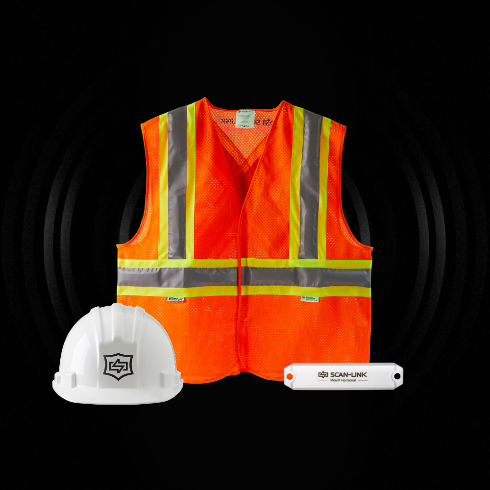 An orange vest a white hard hat and a white scan-link device