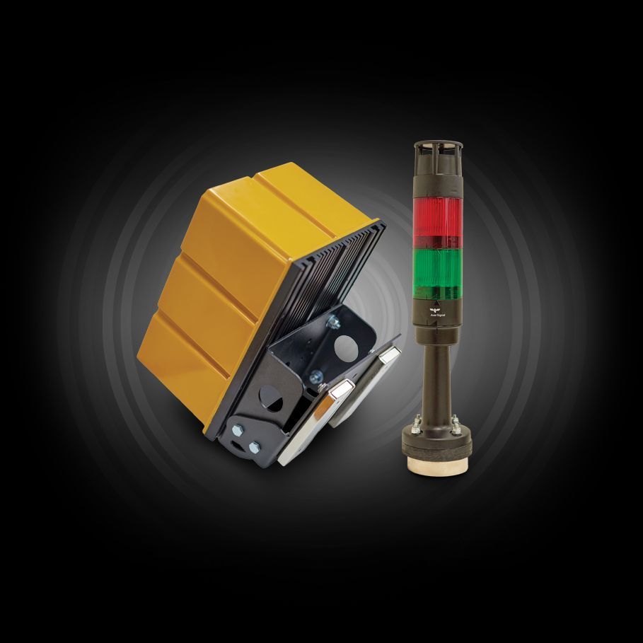A yellow box and a red green and brown tower on a black background