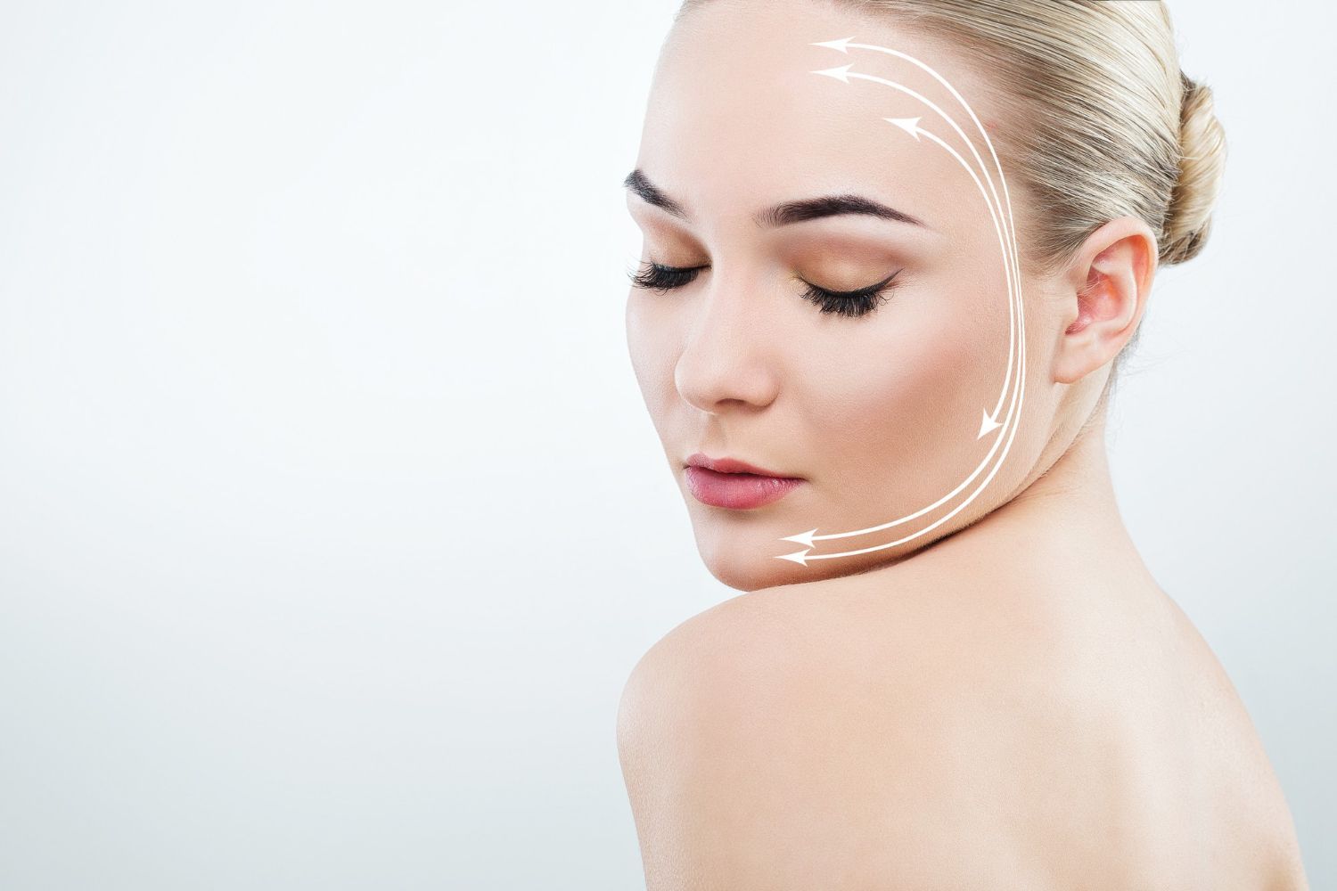 A close up of a woman 's face with arrows pointing to it.
