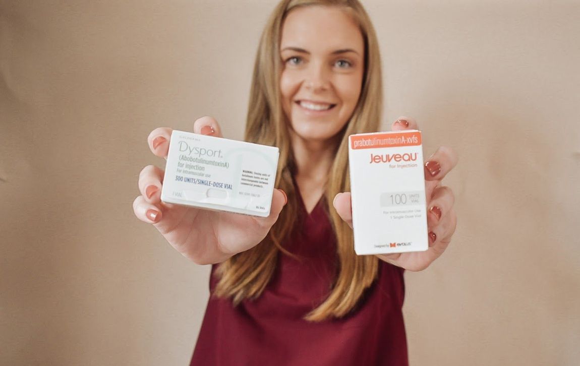 A woman is holding two boxes of pills in her hands.