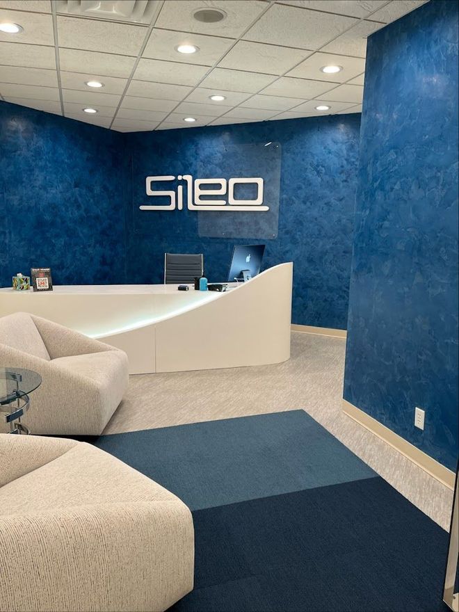 A waiting room with blue walls and a sign that says silo