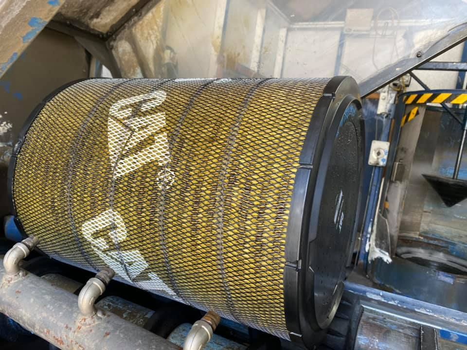 A Cat Air Filter Is Sitting On Top Of A Machine — Filta-Wash Mackay In North Mackay, QLD