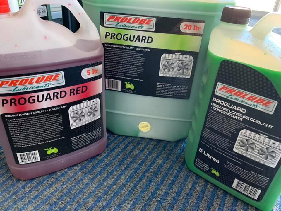 Three Bottles Of Proguard Are Sitting On A Table — Filta-Wash Mackay In North Mackay, QLD