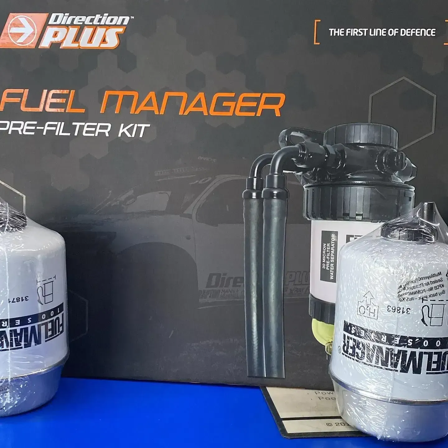 A Direction Plus Fuel Manager Pre Filter Kit Is Sitting On A Blue Table — Filta-Wash Mackay In North Mackay, QLD