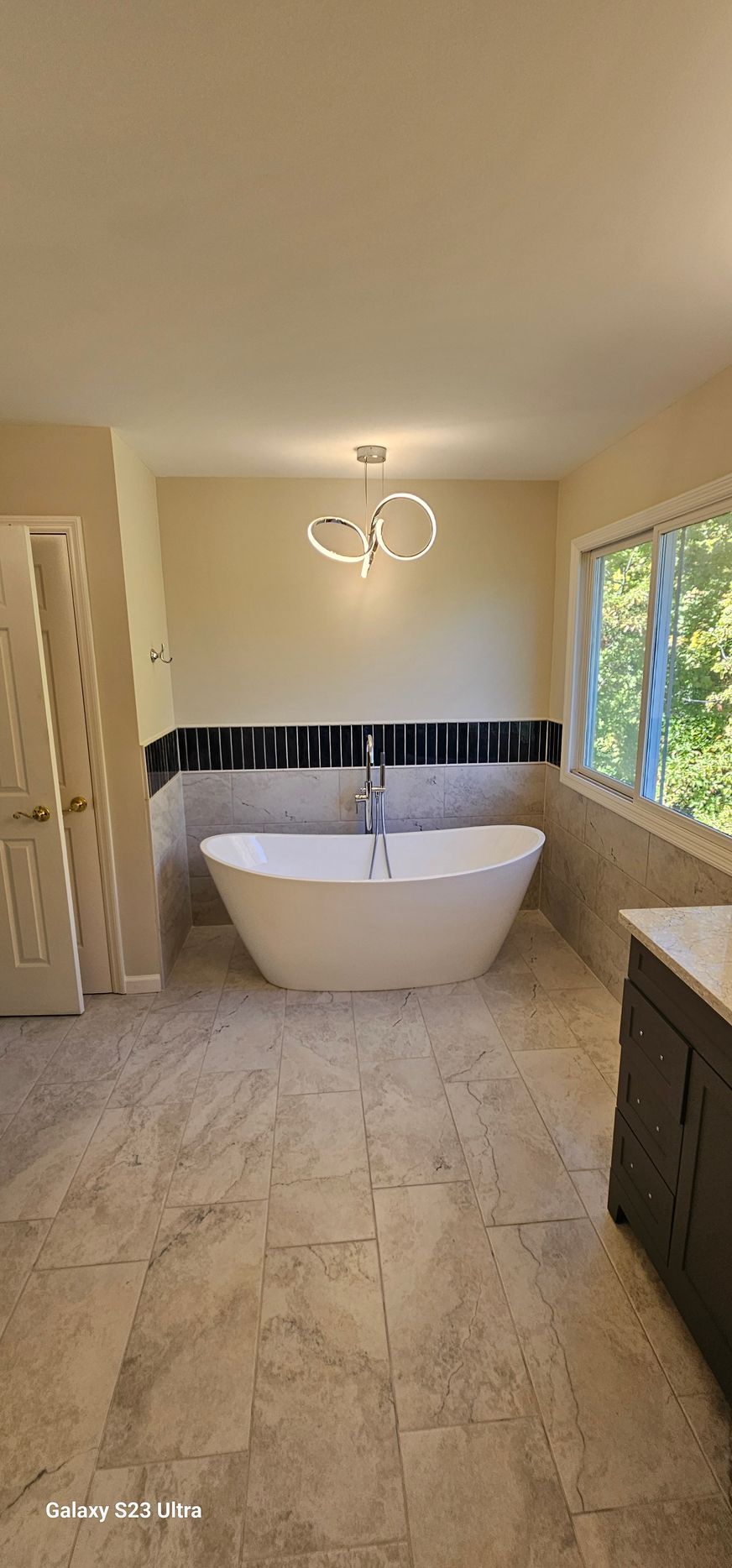 There is a bathtub in the middle of the bathroom.