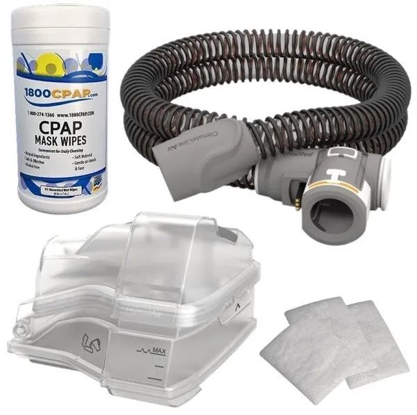 A kit containing a container of CPAP mask wipes, a gray tubing hose, a clear water chamber, and two small white filters.