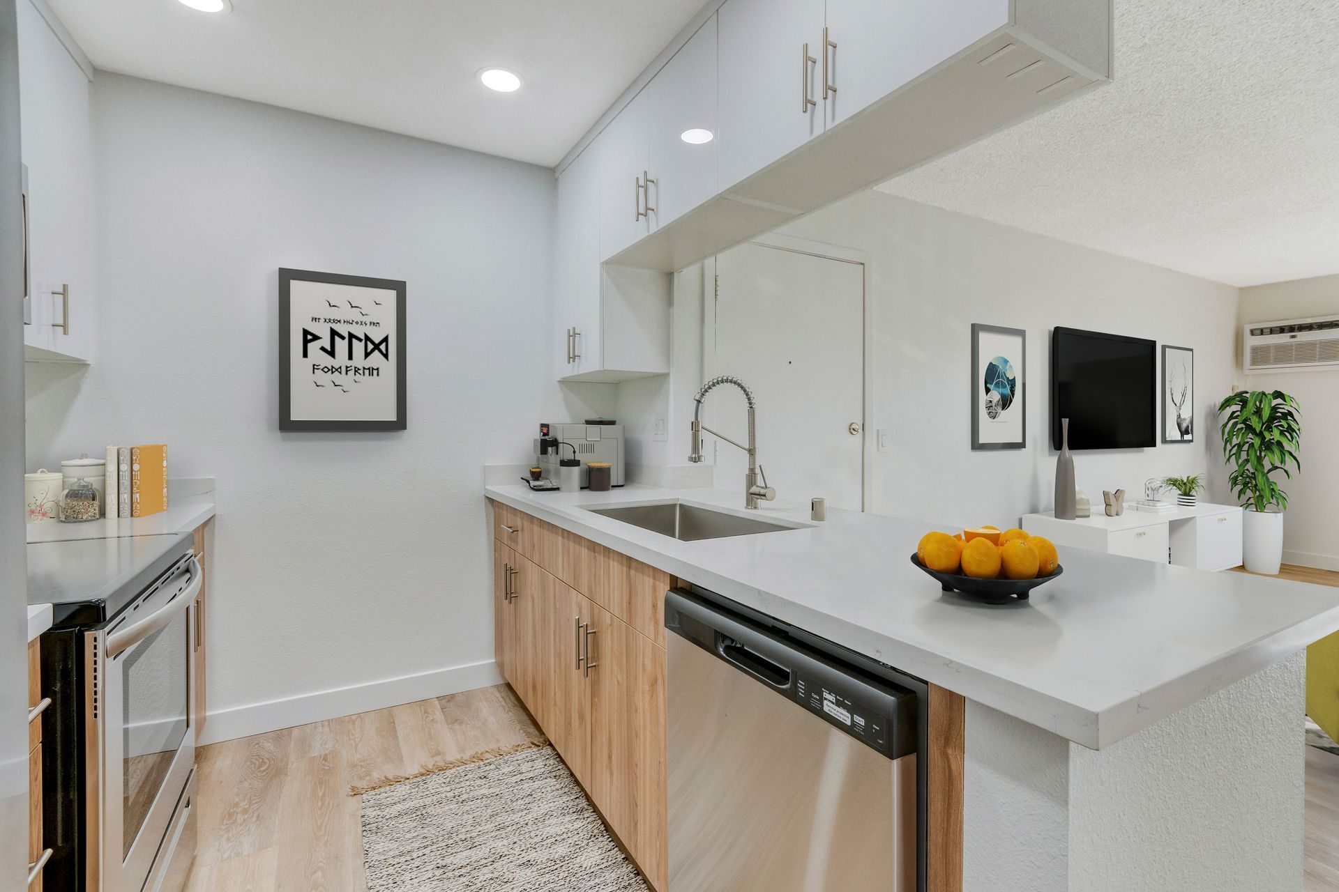 A kitchen with stainless steel appliances and wooden cabinets