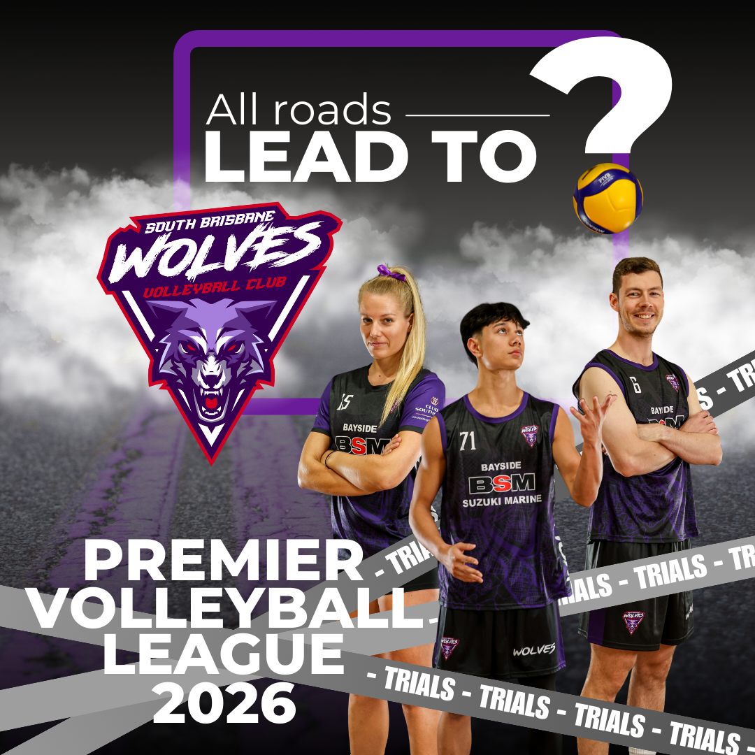 A group of girls are playing volleyball in a gym.