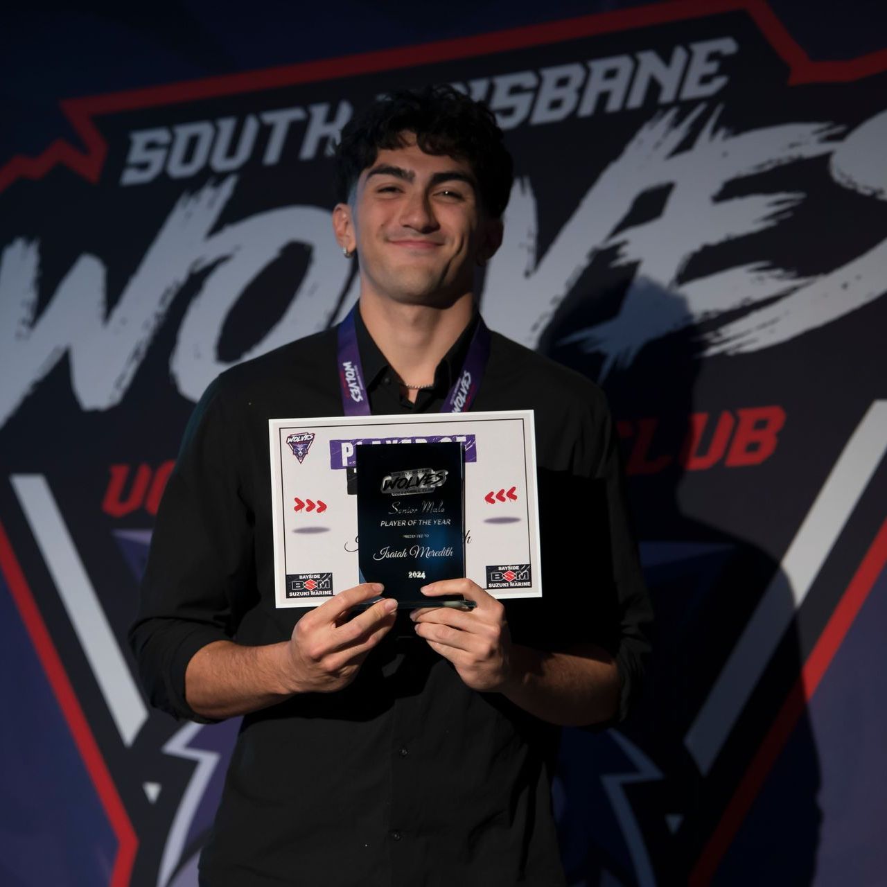 A man in front of a sign that says south brisbane