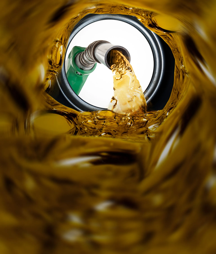 A green gas pump is pouring gas into a can | Yes! Automotive