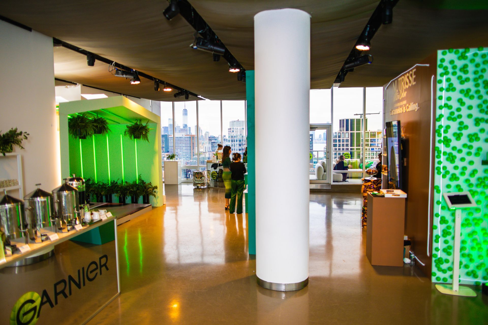 A large room with a sign that says garnier on it